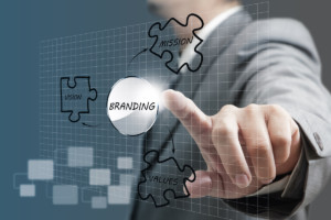 business man hand point to branding diagram