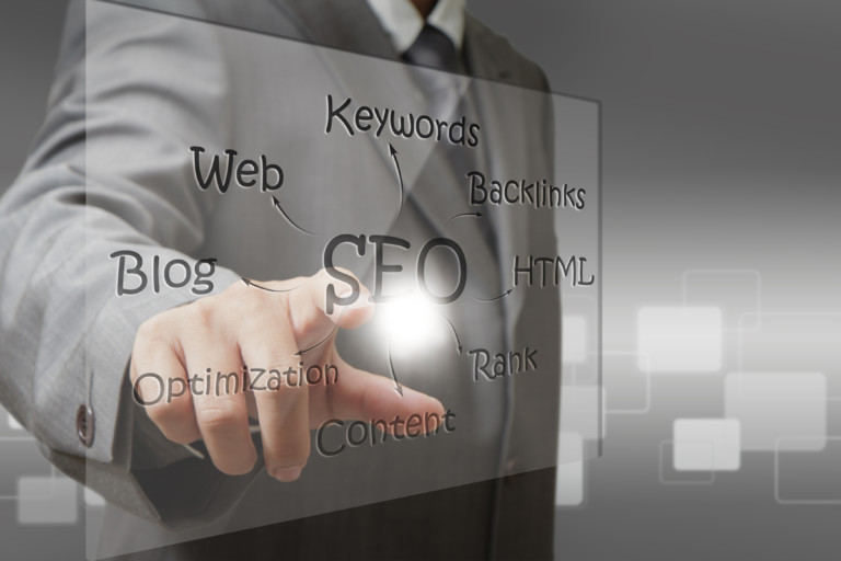 business man hand point on SEO diagram screen