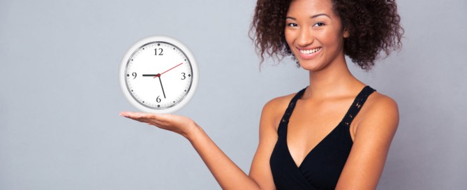 Woman holding Clock