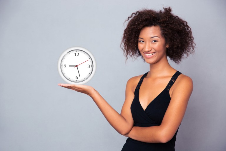 Woman holding Clock