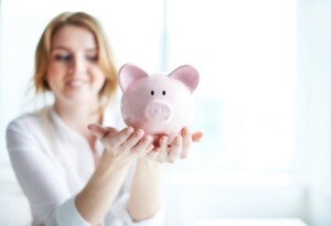 Woman Holding Piggy Bank