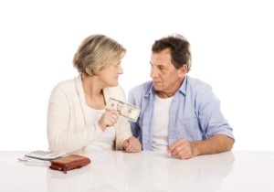 Senior Couple with Wallet & Money